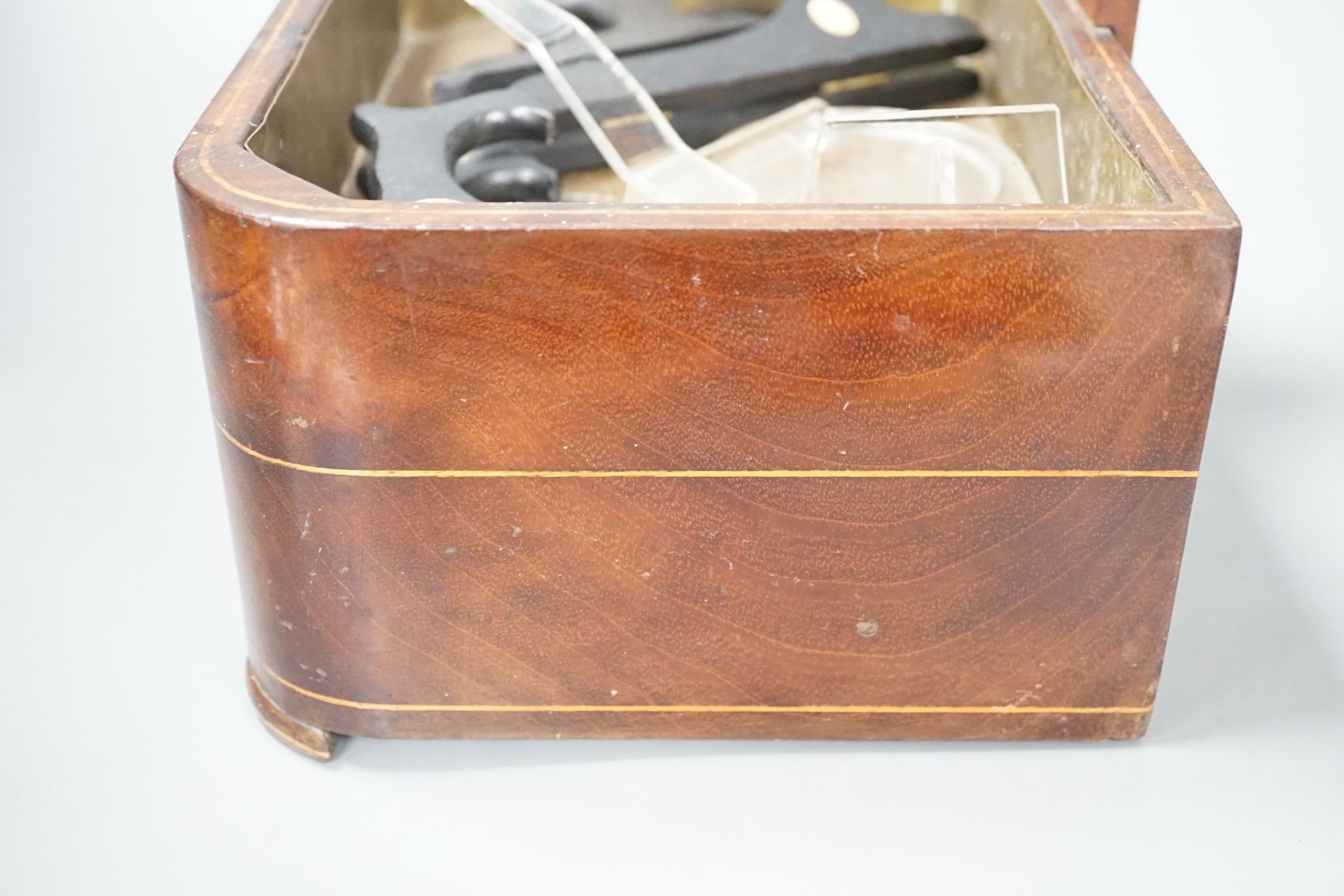 A 19th century satinwood strung mahogany stick stand with fitted drawer, 54 cms high.
